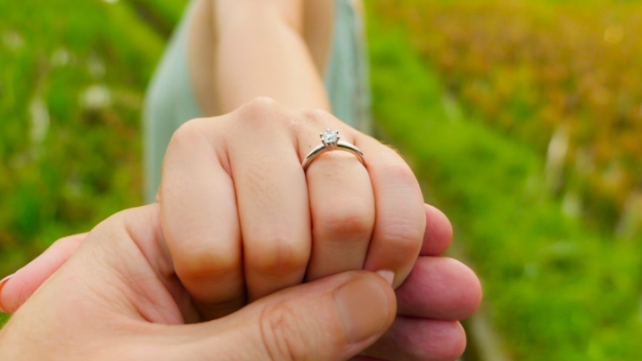 Close Up Couple Hands Man Holding Happy Fiance Hand With Diamond On Picture Id1078960088