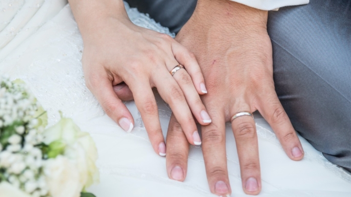 Hands Of A Just Married Couple With The Wedding Rings Picture Id1215684502