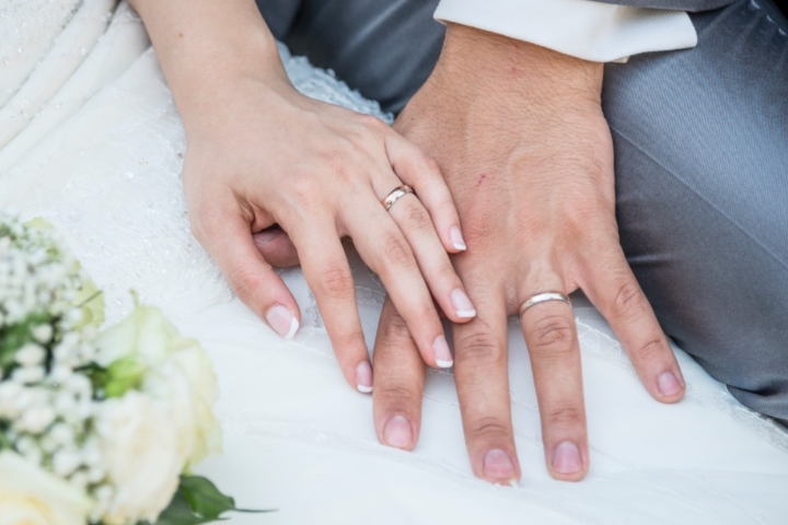 Hands Of A Just Married Couple With The Wedding Rings Picture Id1215684502